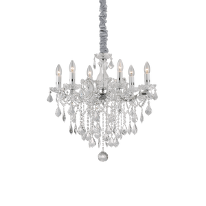 Montatura in metallo con elementi decorativi in vetro. Pendagli con ottagoni e gocce finali in cristallo molato. Disponibile nelle versioni con vetro trasparente e metallo dorato o cromato.