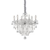 Montatura in metallo con elementi decorativi in vetro. Pendagli con ottagoni e gocce finali in cristallo molato. Disponibile nelle versioni con vetro trasparente e metallo dorato o cromato.