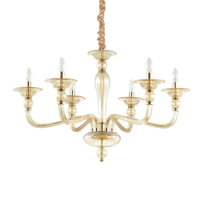 Montatura in metallo cromato o dorato. Elementi decorativi in vetro soffiato trasparente o ambrato. Copricatena in velluto.