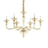Montatura in metallo cromato o dorato. Elementi decorativi in vetro soffiato trasparente o ambrato. Copricatena in velluto.