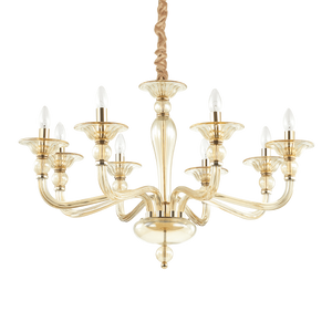 Montatura in metallo cromato o dorato. Elementi decorativi in vetro soffiato trasparente o ambrato. Copricatena in velluto.