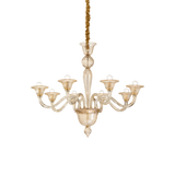 Lampadario in vetro soffiato e lavorato artigianalmente con montatura in metallo e copricatena in velluto.